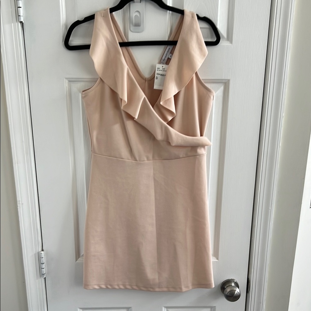 The Vanity Room Sand Blush Ruffle Surplice Mini Dress